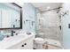 Bathroom features a walk-in shower with tile surround and a modern vanity at 4755 Lightkeepers Way # 15-F, Little River, SC 29566