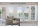 Living area features comfortable seating and access to a balcony with water views at 4755 Lightkeepers Way # 15-F, Little River, SC 29566