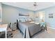 Bright bedroom with a queen bed, ensuite bathroom access, and a desk at 4755 Lightkeepers Way # 15-F, Little River, SC 29566