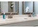 Bathroom features double vanity with marble countertop and modern faucets at 4755 Lightkeepers Way # 15-F, Little River, SC 29566