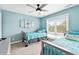 Bedroom with twin beds, coastal decor and large window at 4755 Lightkeepers Way # 15-F, Little River, SC 29566