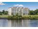 Building waterfront view, with lawn and trees at 2151 Bridgeview Ct. # 3-303, North Myrtle Beach, SC 29582