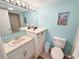 Bathroom featuring a vanity with ample counter space and a toilet at 2000 Ocean Blvd. S # 306, Myrtle Beach, SC 29577