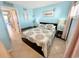 Beach-themed bedroom with a comfortable bed and en-suite bathroom access at 2000 Ocean Blvd. S # 306, Myrtle Beach, SC 29577