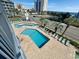 Elevated view of resort-style pool with multiple lounge chairs at 2000 Ocean Blvd. S # 306, Myrtle Beach, SC 29577