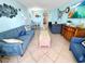 Beach-themed living room with comfortable seating and dining area at 2000 Ocean Blvd. S # 306, Myrtle Beach, SC 29577