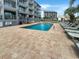 Refreshing outdoor pool with plenty of lounge chairs for relaxing at 2000 Ocean Blvd. S # 306, Myrtle Beach, SC 29577