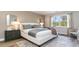 Spacious bedroom with king-size bed, nightstands and large window at 7046 Shooting Star Way, Myrtle Beach, SC 29579