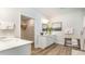 Clean bathroom with white vanity, walk-in shower, and linen closet at 7046 Shooting Star Way, Myrtle Beach, SC 29579