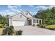 Gray house with white garage door and landscaping at 7046 Shooting Star Way, Myrtle Beach, SC 29579