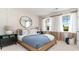 Cozy bedroom featuring a wooden bed frame, neutral color palette, and ample natural light at 7046 Shooting Star Way, Myrtle Beach, SC 29579
