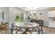 Casual dining area with round wooden table and chairs, and access to backyard patio at 7046 Shooting Star Way, Myrtle Beach, SC 29579