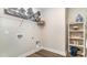 Convenient laundry room with shelving, a built-in washer/dryer, and storage at 7046 Shooting Star Way, Myrtle Beach, SC 29579