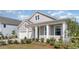 Gray house with white garage and landscaping at 7046 Shooting Star Way, Myrtle Beach, SC 29579