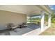 Covered patio with outdoor furniture overlooking a pond at 7046 Shooting Star Way, Myrtle Beach, SC 29579