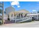 Cute beach cottage with a porch, ramp access, and a paved driveway at 6001-5027 S Kings Hwy., Myrtle Beach, SC 29575