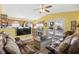 Cozy living room with leather sofas, large TV, and access to the porch at 6001-5027 S Kings Hwy., Myrtle Beach, SC 29575