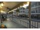 Relaxing front porch with ceiling fan, string lights, and neighborhood view at 6001-5027 S Kings Hwy., Myrtle Beach, SC 29575
