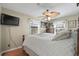 Main bedroom with ceiling fan and large window at 6001-5027 S Kings Hwy., Myrtle Beach, SC 29575