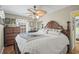 Bedroom with ceiling fan and wood dresser at 6001-5027 S Kings Hwy., Myrtle Beach, SC 29575