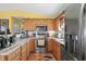 Modern kitchen with stainless steel appliances and wood cabinets at 6001-5027 S Kings Hwy., Myrtle Beach, SC 29575