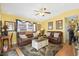 Bright living room with leather sofas and hardwood floors at 6001-5027 S Kings Hwy., Myrtle Beach, SC 29575