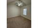 Spacious bedroom with a window and ceiling fan at 4870 Luster Leaf Circle # 401, Myrtle Beach, SC 29577
