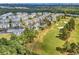 Aerial view of community near golf course and ocean at 4870 Luster Leaf Circle # 401, Myrtle Beach, SC 29577
