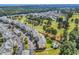 Aerial view of condo building with pool and parking at 4870 Luster Leaf Circle # 401, Myrtle Beach, SC 29577