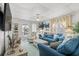 Living room with blue sofas, coastal decor, and access to a porch at 6001-1092 S Kings Hwy., Myrtle Beach, SC 29575