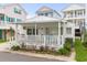 Charming white cottage with a porch, perfect for relaxing! at 6001-1092 S Kings Hwy., Myrtle Beach, SC 29575