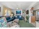 Bright living room with comfortable seating and coastal decor at 6001-1092 S Kings Hwy., Myrtle Beach, SC 29575