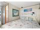 Bedroom with white headboard, beach art, and adjacent bathroom at 6001-1092 S Kings Hwy., Myrtle Beach, SC 29575