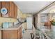 Cozy kitchen with wood cabinets and white appliances at 6001-1092 S Kings Hwy., Myrtle Beach, SC 29575