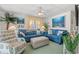 Living room featuring blue sofas, coastal art, and a ceiling fan at 6001-1092 S Kings Hwy., Myrtle Beach, SC 29575