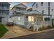 Front of house with small yard and golf cart at 6001-1092 S Kings Hwy., Myrtle Beach, SC 29575
