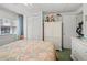 Bright bedroom with seashell bedding, white dresser, and built-in closet at 6001-1092 S Kings Hwy., Myrtle Beach, SC 29575