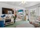 Living room showcasing coastal decor and a large flat-screen TV at 6001-1092 S Kings Hwy., Myrtle Beach, SC 29575