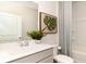 Clean and modern bathroom with a gray vanity and shower/tub combo at 331 Cheerful Way, Little River, SC 29566
