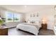 Bright bedroom with a king-size bed, large window, and wood-look floors at 331 Cheerful Way, Little River, SC 29566
