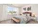 Cozy bedroom with a rattan bed frame and neutral color palette at 331 Cheerful Way, Little River, SC 29566