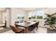 Dining room with a large wooden table and wicker chairs at 331 Cheerful Way, Little River, SC 29566