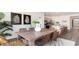 Dining area with kitchen view, wood table, and wicker chairs at 331 Cheerful Way, Little River, SC 29566