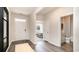 Bright and airy foyer with wood-look floors and access to a bathroom at 331 Cheerful Way, Little River, SC 29566