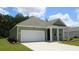 New construction home with a spacious driveway and attractive facade at 331 Cheerful Way, Little River, SC 29566