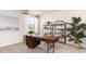 Functional home office with built-in shelving and a large desk at 331 Cheerful Way, Little River, SC 29566