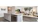 Open concept kitchen with island and view into the living room at 331 Cheerful Way, Little River, SC 29566