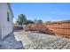 Backyard with stone patio and wooden fence at 8586 Edgewood Dr., Myrtle Beach, SC 29588