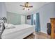 Bedroom with a queen bed and light teal walls at 8586 Edgewood Dr., Myrtle Beach, SC 29588