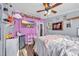 bedroom with a TV, built-in shelving, and whimsical decor at 8586 Edgewood Dr., Myrtle Beach, SC 29588